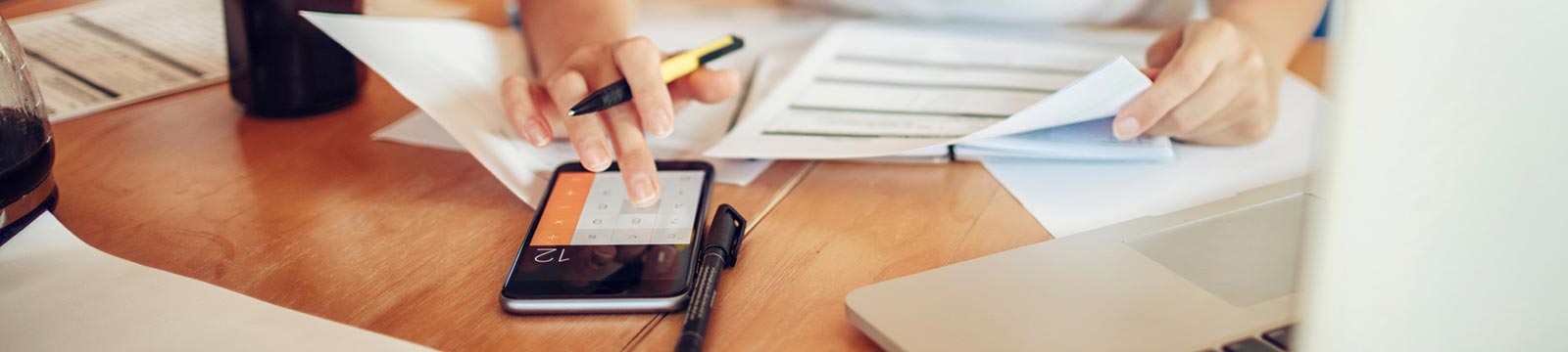 Person using a calculator to do finances.